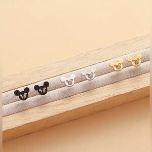 Set of 3 Mickey Mouse stainless steel stud earrings.